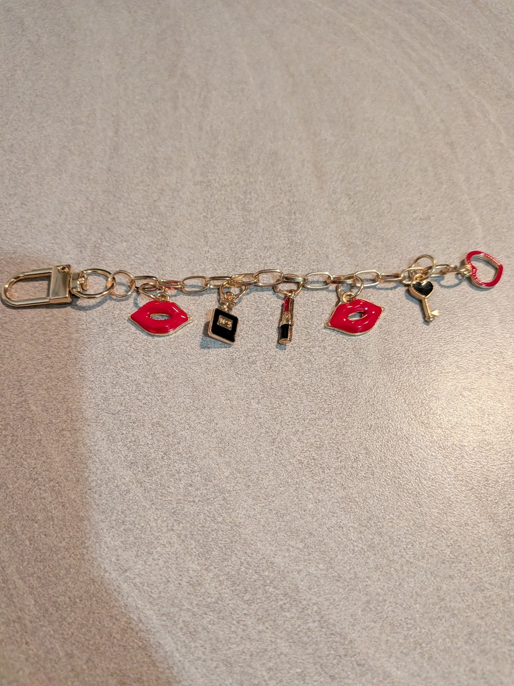 Gold-Tone Charm Bracelet with Red Lip & Key Charms
